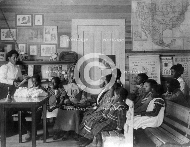 African American children and teacher in classroom studying..., Annie Davis School...Alabama, c1902. Creator: Frances Benjamin Johnston.