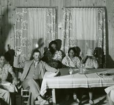 African American men and women sitting in attendance at a meeting to discuss farm..., May 1940. Creator: Farm Security Administration