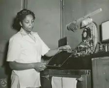 African American Private Hannah Wills developing an x-ray film in the x-ray laboratory..., 1943. Creator: Unknown