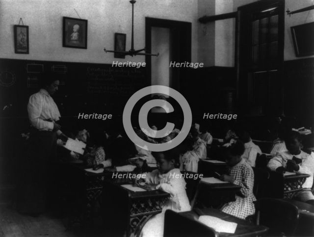 African American school children at work on a craft project, (1899?). Creator: Frances Benjamin Johnston.