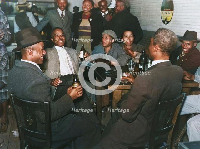 African Americans conversing and drinking beers in a bar, Clarksdale, Mississippi Delta, Nov 1939. Creators: Farm Security Administration, Marion Post Wolcott.