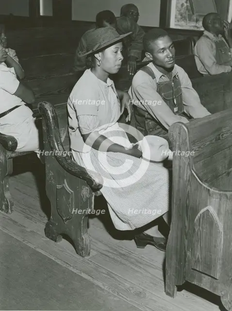 African Americans sitting in pews at a meeting of Farm Security Administration borrowers..., 1941. Creators: Farm Security Administration, Jack Delano.