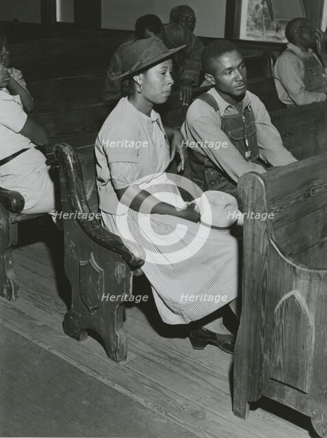 African Americans sitting in pews at a meeting of Farm Security Administration borrowers..., 1941. Creators: Farm Security Administration, Jack Delano.