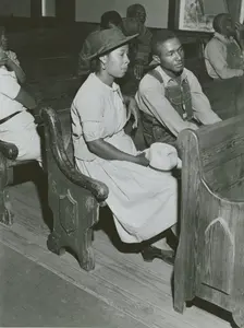 African Americans sitting in pews at a meeting of Farm Security Administration borrowers..., 1941. Creators: Farm Security Administration, Jack Delano