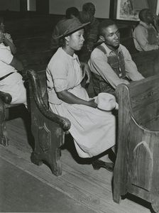 African Americans sitting in pews at a meeting of Farm Security Administration borrowers..., 1941. Creators: Farm Security Administration, Jack Delano