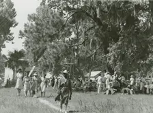 African Americans walking in an open field at a picnic, Beaufort, South Carolina, July 4, 1939. Creators: Farm Security Administration, Marion Post Wolcott