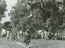 African Americans walking in an open field at a picnic, Beaufort, South Carolina, July 4, 1939. Creators: Farm Security Administration, Marion Post Wolcott