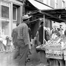 Afro-Caribbean man in a market, London, c1960-c1980. Creator: Henry Grant