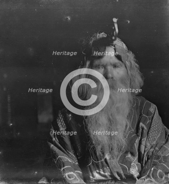 Ainu chief wearing a headdress, 1908. Creator: Arnold Genthe.