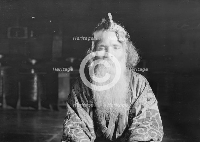 Ainu chief wearing a headdress, 1908. Creator: Arnold Genthe.