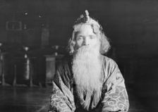 Ainu chief wearing a headdress, 1908. Creator: Arnold Genthe