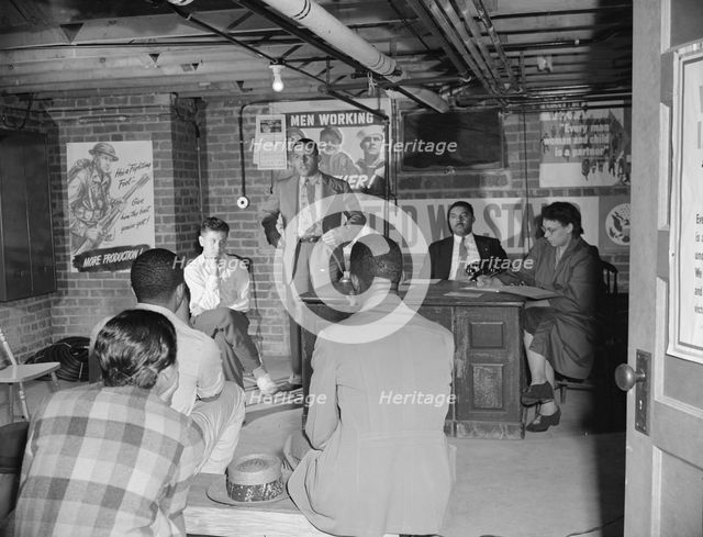 Air raid wardens' meeting in zone nine, Southwest area, Washington, D.C, 1942. Creator: Gordon Parks.