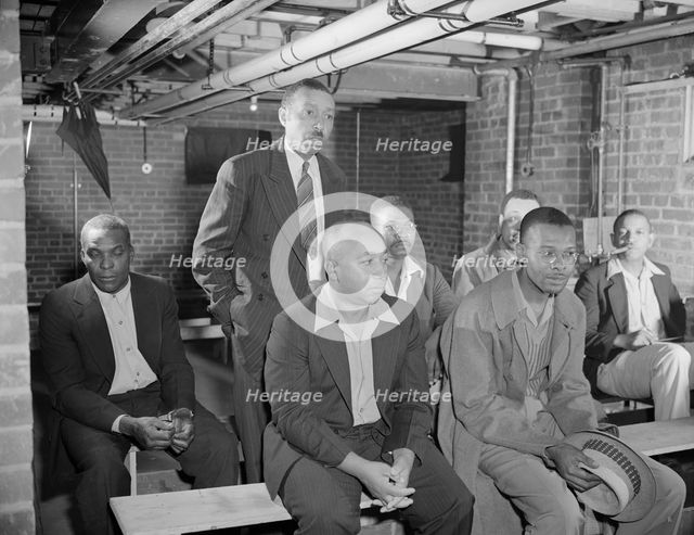 Air raid wardens' meeting in zone nine, Southwest area, Washington, D.C, 1942. Creator: Gordon Parks.
