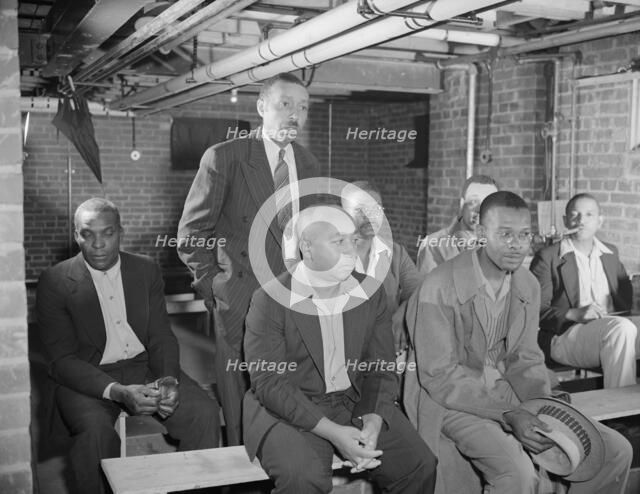Air raid wardens' meeting in zone nine, Southwest area, Washington, D.C, 1942. Creator: Gordon Parks.