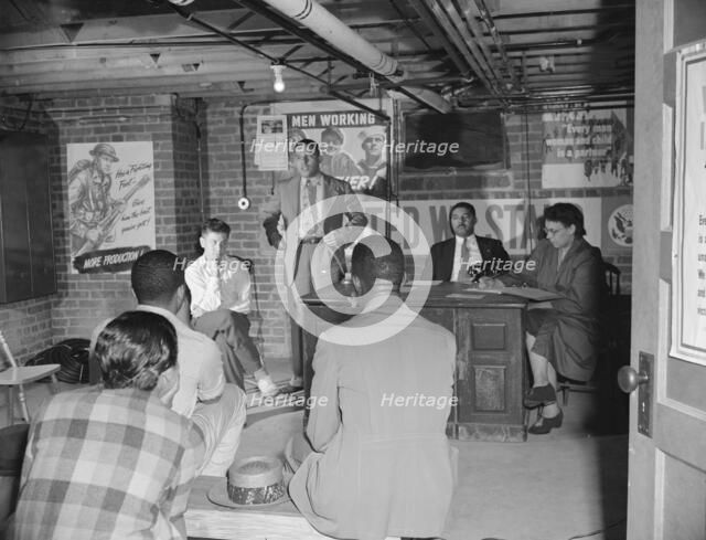 Air raid wardens' meeting in zone nine, Southwest area, Washington, D.C, 1942. Creator: Gordon Parks.
