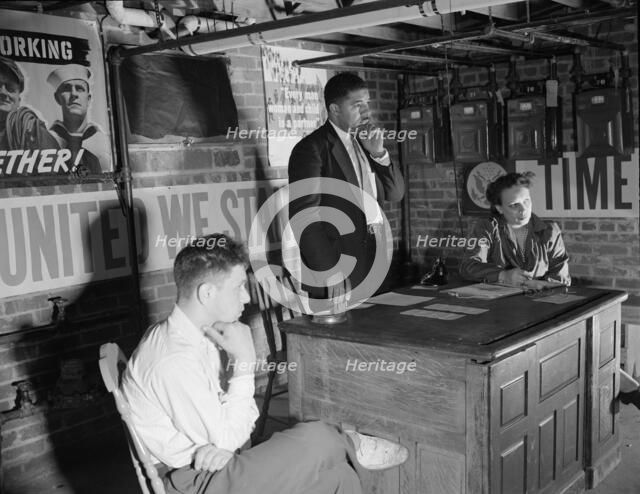 Air raid wardens' meeting in zone nine, Southwest area, Washington, D.C, 1942. Creator: Gordon Parks.