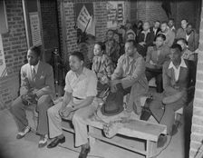Air raid wardens meeting in zone nine, Southwest area, Washington, D.C, 1942. Creator: Gordon Parks