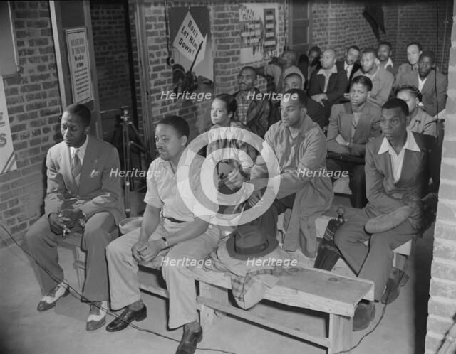 Air raid wardens' meeting in zone nine, Southwest area, Washington, D.C, 1942. Creator: Gordon Parks.