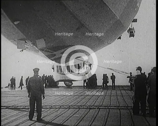 Airship Approaching an Aircraft Carrier And Attempting To Land, 1920s. Creator: British Pathe Ltd.