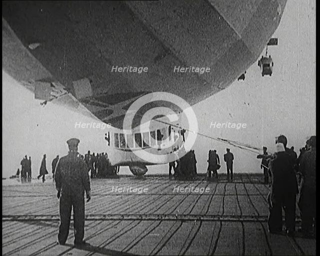 Airship Approaching an Aircraft Carrier And Attempting To Land, 1920s. Creator: British Pathe Ltd.