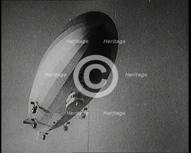 Airship Approaching an Aircraft Carrier And Attempting To Land, 1920s. Creator: British Pathe Ltd.