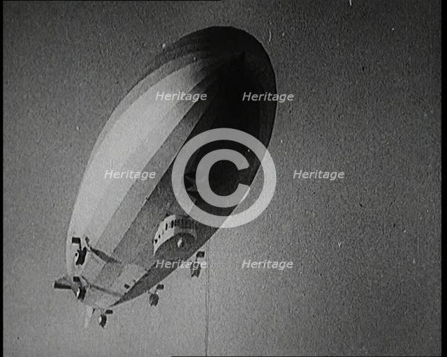 Airship Approaching an Aircraft Carrier And Attempting To Land, 1920s. Creator: British Pathe Ltd.