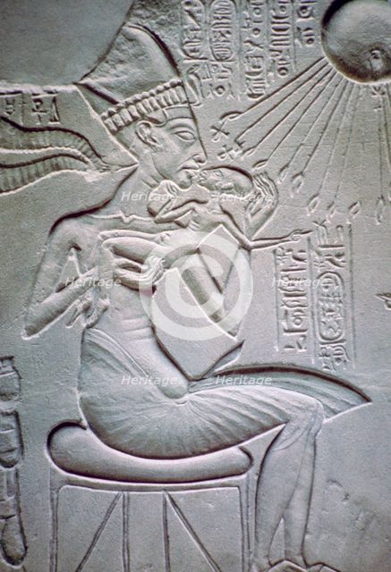 Akhenaten holding one of his daughters. Artist: Unknown