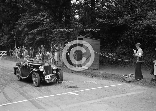 AL Baker's MG Magnette, winner of a bronze award at the MCC Torquay Rally, July 1937. Artist: Bill Brunell.