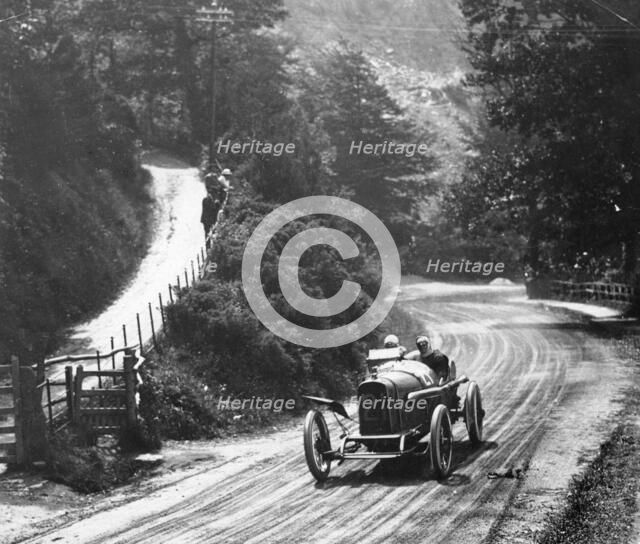 AL Guinness in a Sunbeam, Isle of Man TT race, 1914. Artist: Unknown