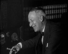 Al Smith, Former Presidential Candidate, Smoking a Cigar And Following Election Results..., 1932. Creator: British Pathe Ltd