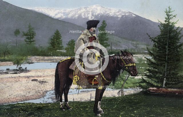 Altai Man in National Costume (Hat: Kuaraan Boruk, Sheepskin Coat: Ton, with a..., 1911-1913. Creator: Sergei Ivanovich Borisov.