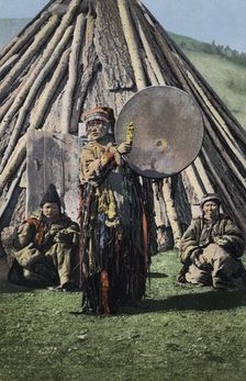 Altai Shaman with Tambourine in Front of a Traditional Dwelling (Chaadyr), 1911-1913. Creator: Sergei Ivanovich Borisov
