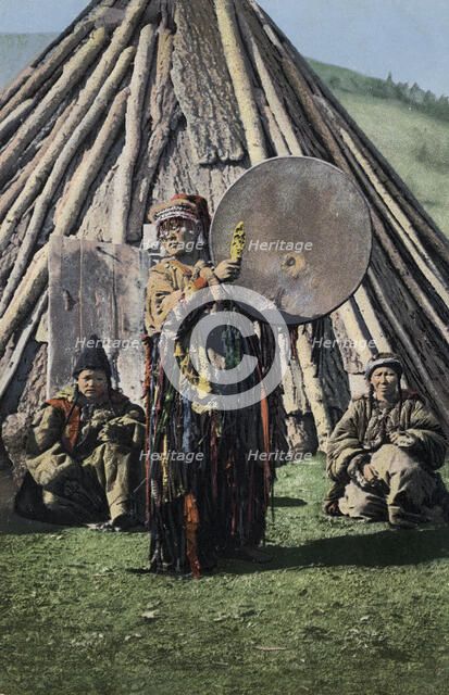 Altai Shaman with Tambourine in Front of a Traditional Dwelling (Chaadyr), 1911-1913. Creator: Sergei Ivanovich Borisov.