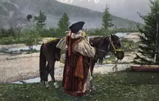 Altai Woman in National Costume (Hat: Kuaraan Boruk, Sheepskin Coat: Ton, Sleeveless..., 1911-1913. Creator: Sergei Ivanovich Borisov