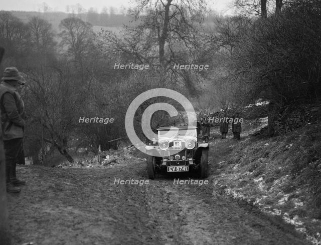 Alvis Silver Eagle of EW Bass competing in the Sunbac Colmore Trial, Gloucestershire, 1933. Artist: Bill Brunell.