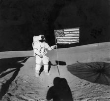 Alan Shepard (1923-1998) planting an American flag during the Apollo 14 mission, 1971