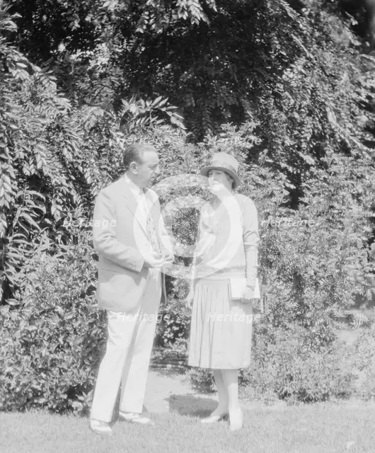 Alanson, Bertram, Mr. and Mrs., standing outdoors, between 1927 and 1937. Creator: Arnold Genthe.