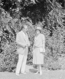 Alanson, Bertram, Mr. and Mrs., standing outdoors, between 1927 and 1937. Creator: Arnold Genthe