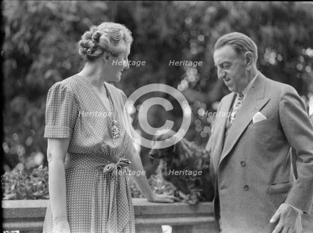 Alanson, Bertram, Mr. and Mrs., with dog, outdoors, between 1927 and 1937. Creator: Arnold Genthe.