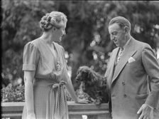 Alanson, Bertram, Mr. and Mrs., with dog, outdoors, between 1927 and 1937. Creator: Arnold Genthe