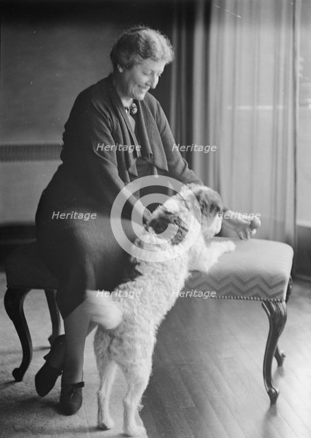 Alanson, Bertram, Mrs., with dog, portrait photograph, between 1927 and 1937. Creator: Arnold Genthe.