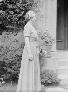 Alanson, Bertram, Mrs., standing outdoors, between 1927 and 1937. Creator: Arnold Genthe