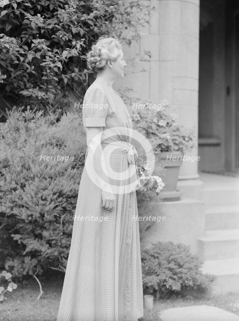 Alanson, Bertram, Mrs., standing outdoors, between 1927 and 1937. Creator: Arnold Genthe.