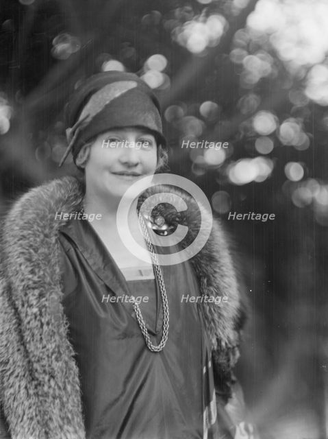 Alanson, Bertram, Mrs., standing outdoors, between 1927 and 1937. Creator: Arnold Genthe.