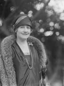 Alanson, Bertram, Mrs., standing outdoors, between 1927 and 1937. Creator: Arnold Genthe