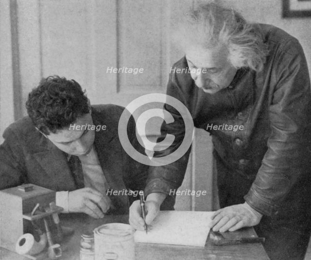 Albert Einstein, German-Swiss-American mathematician and physicist, with a student. Artist: Unknown