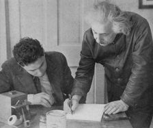 Albert Einstein, German-Swiss-American mathematician and physicist, with a student