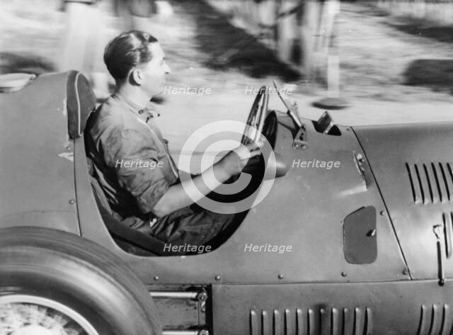 Alberto Ascari at the wheel of a racing car. Artist: Unknown