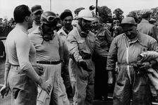 Alberto Ascari, Froilan Gonzalez, Guiseppe Farina (from left to right), and a mechanic