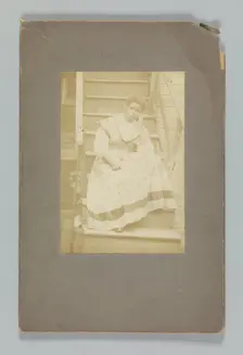 Albumen print of an unidentified woman sitting on stairs, 1850-1895. Creator: Unknown